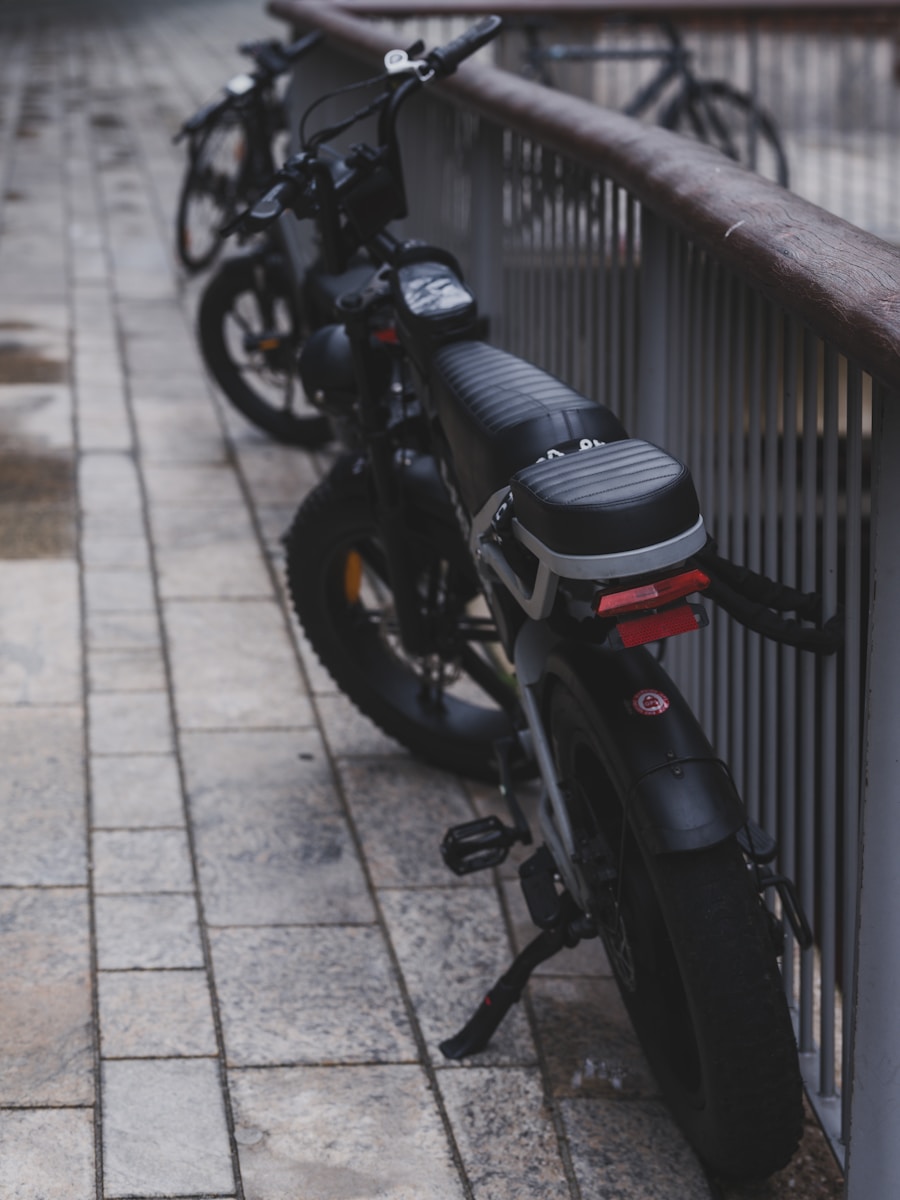 A black bicycle leans against a railing.