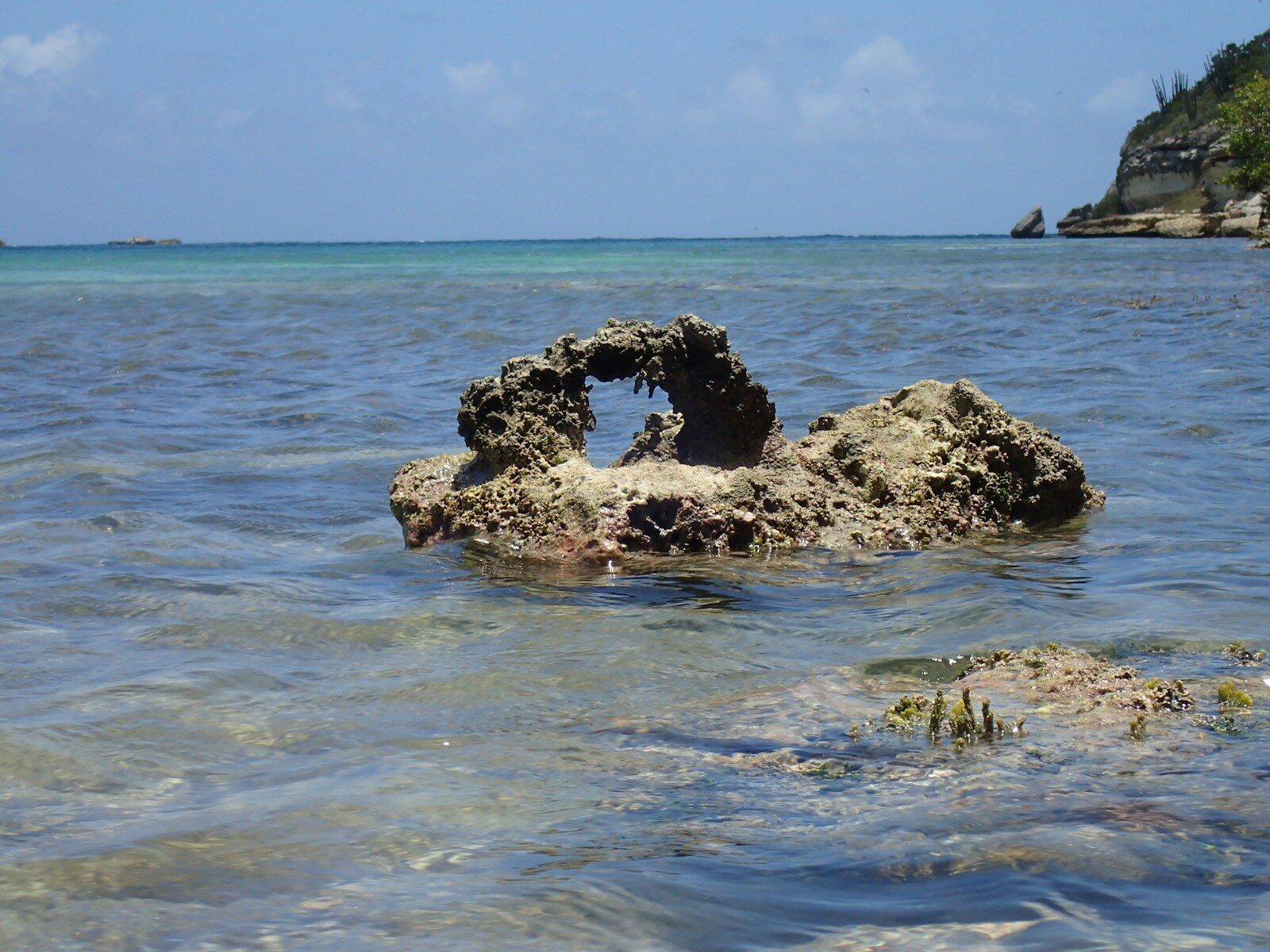a rock in the middle of the ocean