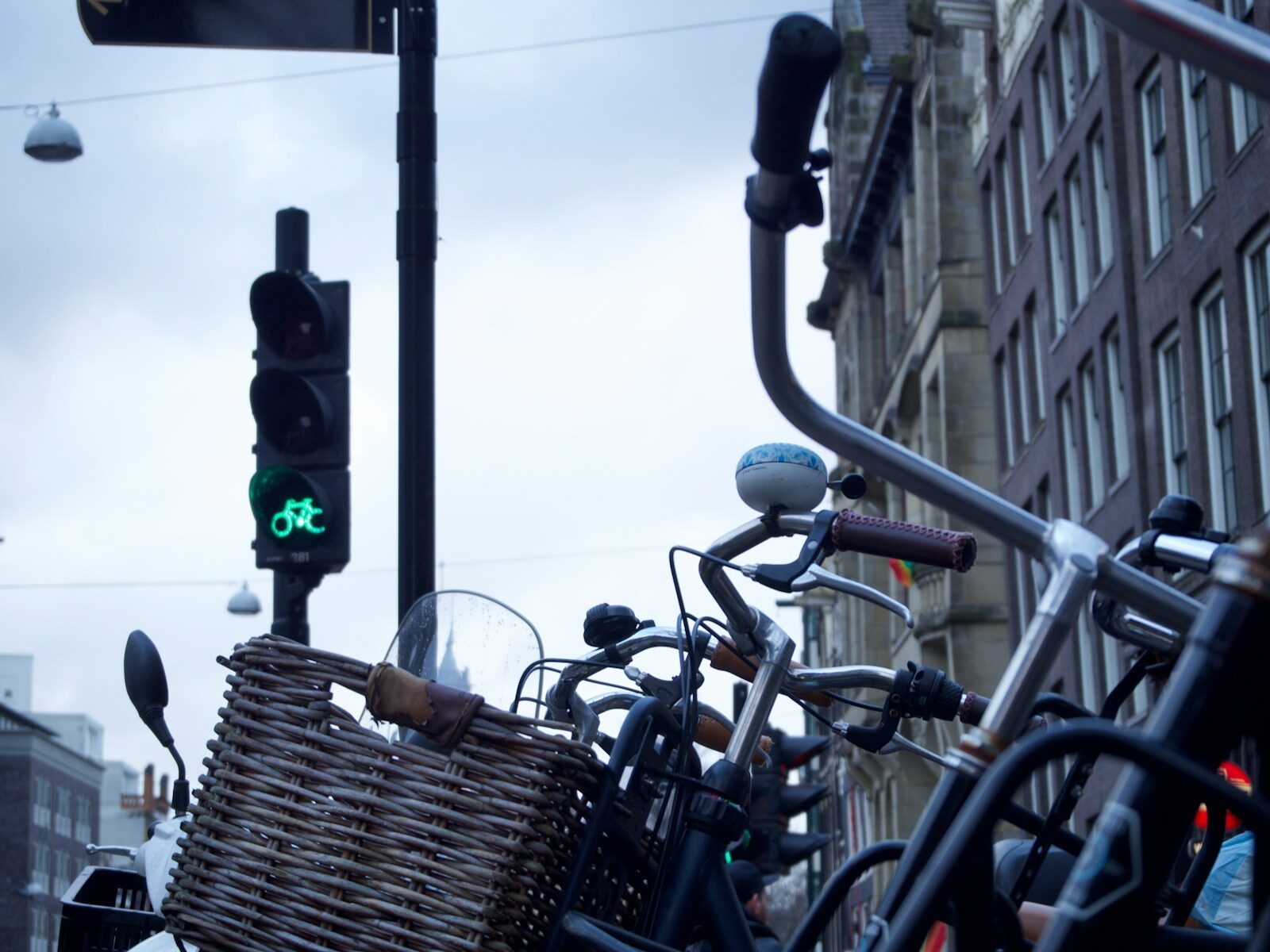a group of bicycles parked next to a traffic light